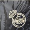 tunique-de-supporter-real-madrid-design-dragon-rouge-sur-fond-noir-collection-2024-2025 Tunique de supporter Real Madrid design dragon rouge sur fond noir collection 2024 2025
