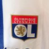 maillotOLdomicileLOGO.jpg Koszulka Olympique Lyonnais Domowa 2024-2025 detal tkaniny